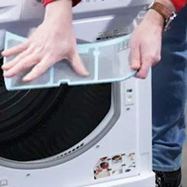 Les filtres du sèche-linge sont saturés de peluches